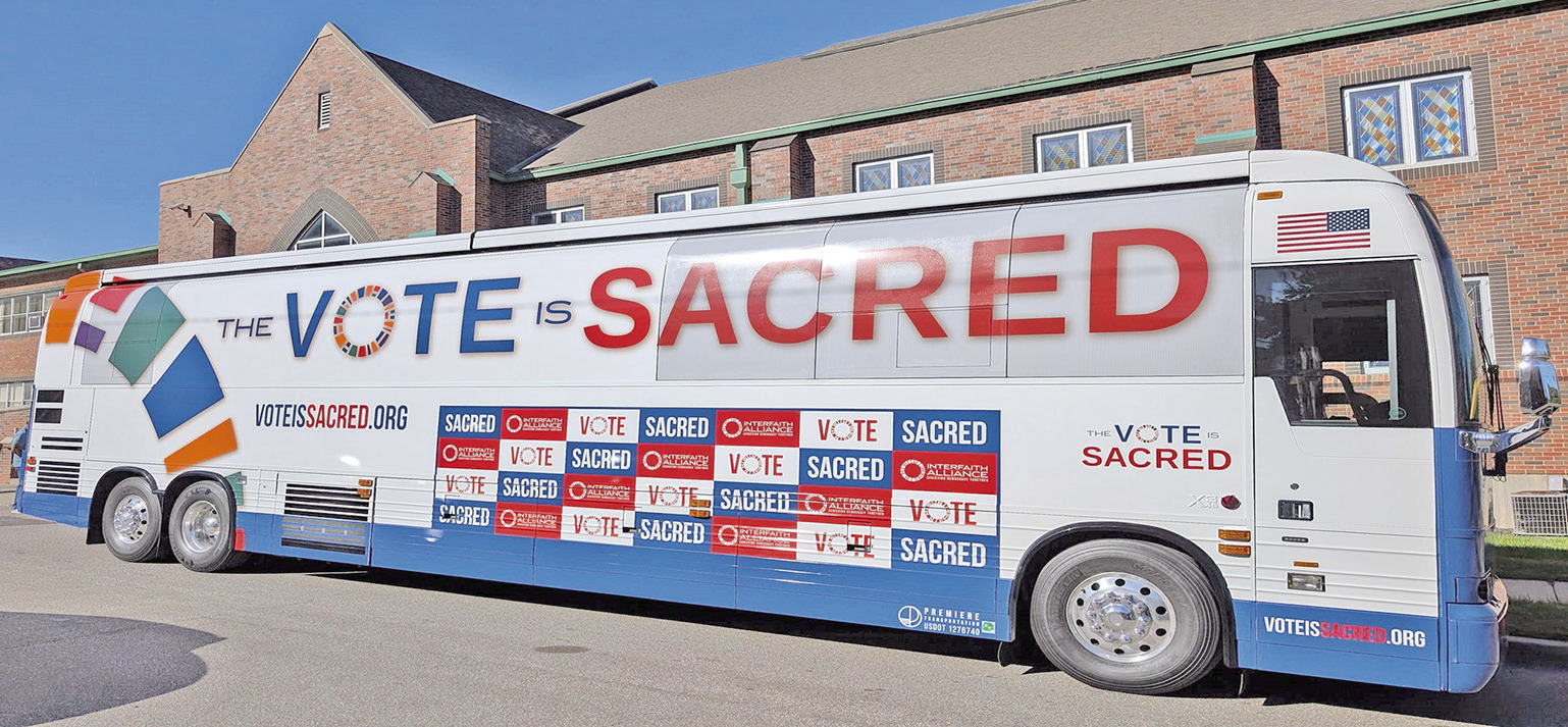 The bus for Interfaith Alliance “The Vote Is Sacred Tour” parked outside St. James United Methodist Church in Kansas City, Missouri, on Oct. 5, 2026. (Brian Kaylor/ Word&amp;Way)