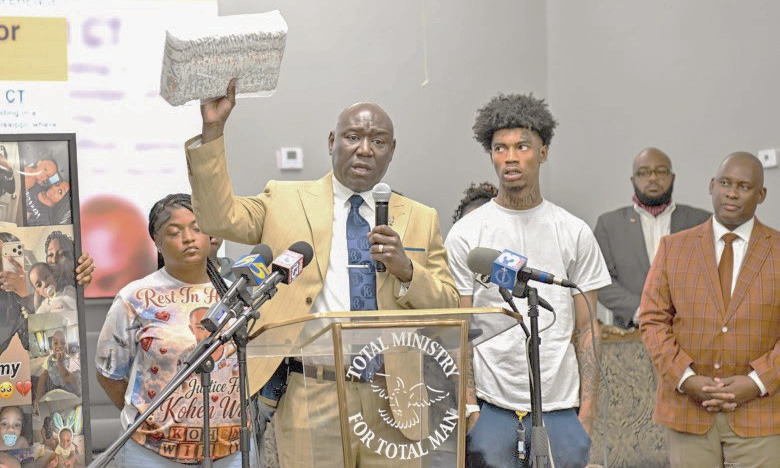 Family members of baby Kohen Wiley, including his father Davion Williams, right, join Atty. Ben Crump at a press conference in Senatobia, Mississippi, on Monday, June 22. (Gary S. Whitlock/Tri-State Defender)
