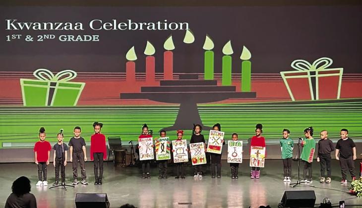 First and second grade students from African Centered College Preparatory Academy at the Kwanzaa celebration.