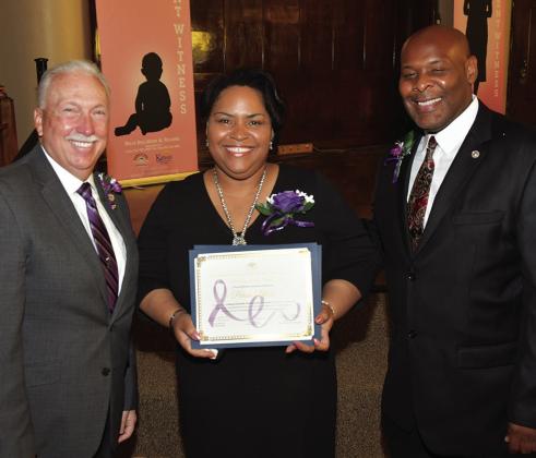 From left: Representative/Commissioner Thomas Burroughs; Porcia Block, honoree; KCK Mayor Tyrone Garner