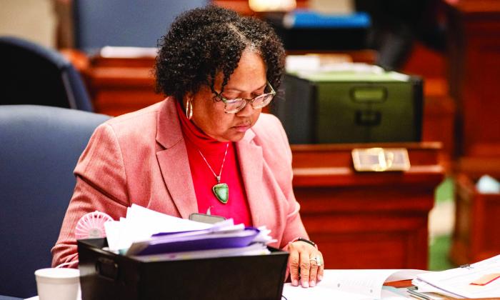 Sen. Barbara Washington, a Democrat from Kansas City, sits at her desk on the Missouri Senate floor. Washington has sponsored a bill banning hair discrimination for years in the Missouri State Legislature (Annelise Hanshaw/Missouri Independent).
