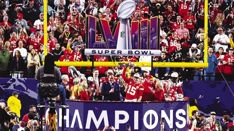 Kansas City Chiefs Quarterback Patrick Mahomes hoists the trophy after Sunday’s Super Bowl LVIII victory over the 49ers. courtesy photo/kcchiefs