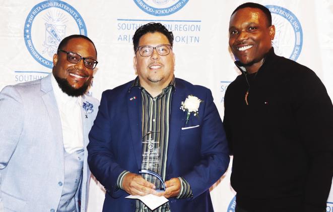 Leo Prieto, ( center) and Andre Sigler ( right) accept the Community Service Award for the Linwood YMCA presented by Brandon Hill, Southwestern Regional Director of Phi Beta Sigma Fraternity. photo/George Barrett