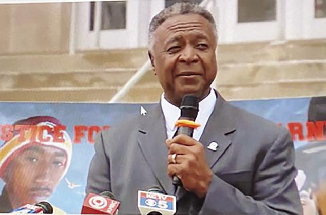 A banner with the late Cameron Lamb’s photo provided a backdrop during Wednesday’s press conference as Jackson County Executive Frank White spoke.