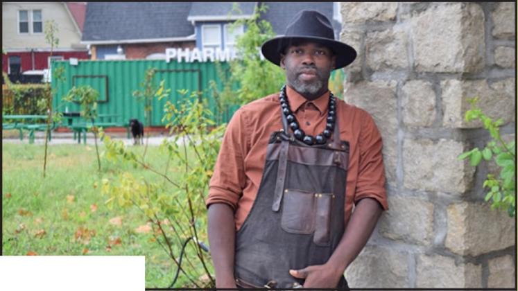 Phillip Ramsey, a master gardener, stands in the Ruby Jeans Community Garden at 29th Street and Wabash Avenue in Kansas City, Missouri, where he grows and distributes fresh produce to neighbors. (Thomas White/ The Beacon)