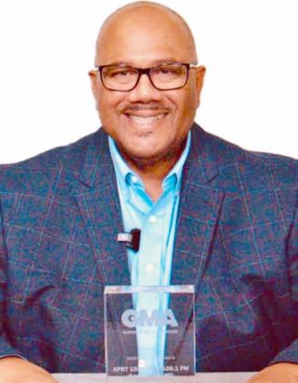 Myron Fears, operations manager for Carter Broadcast Group holds the GMA 2026 Radio Impact Award.