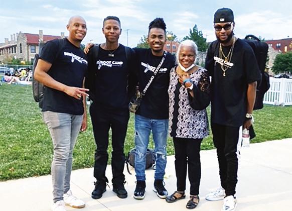 “AJM CELEBRATES BIRD” ON 18TH &amp;amp; VINE: Touring Musicians (from left) trumpeter Alonzo Demetrius, drummer Christian Napoleon, pianist Miles Lennox and Kansas City saxophonist Houston Smith with Johnson County NAACP board member Wandra Minor at AJM’s ‘In the Yard’ concert series following their performance. Featured artists included Morgan Faw &amp;amp; the Flame, Shedrick Mitchell and Jackiem Joyner.