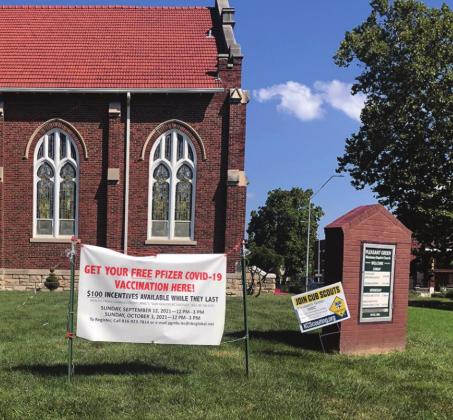 A banner outside welcomed attendees to UMKC’s “Our Healthy Kansas City Eastside” vaccination event Sunday at Pleasant Green Missionary Baptist Church.
