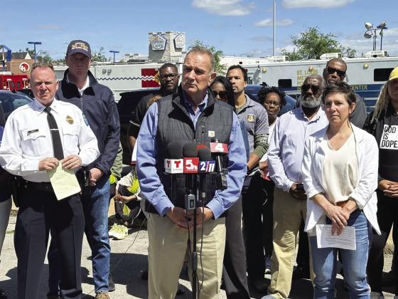 Governor Mike Kehoe (center) at a press conference in St. Louis following the tornado. photo/St. Louis American
