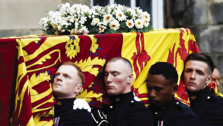 Queen Elizabeth II, who passed away last Thursday, September 8, is being remembered by throngs of mourners at various services that have been held all week long. Her funeral will be held September 19 at Westminster Abbey. In this photo, the Queen’s coffin arrives at the Palace of Holyroodhouse in Edinburgh on Sunday, September 11. Alkis Konstantinidis/Pool/AP