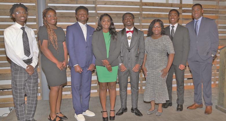 Beta Omega Chapter of the Omega Psi Phi Fraternity Inc. recently presented $1,000 awards to eight 'Distinguished Scholars.' Shown at the reception from left to right: Quentin King, Makayla McConnell, Kaleb Smith, Chloe Ervin, Christian Graham, Skylah Canady, Langston Humphrey, Davis Long.