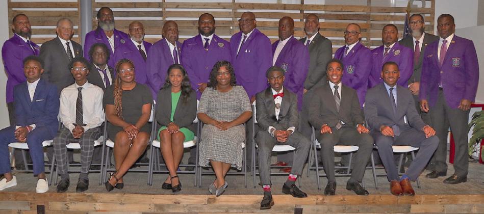 'Distinguished Scholars,' proud family members and supportive friends at the 'Distinguished Scholars' shown with 'Men of Omega' at the reception. reception.