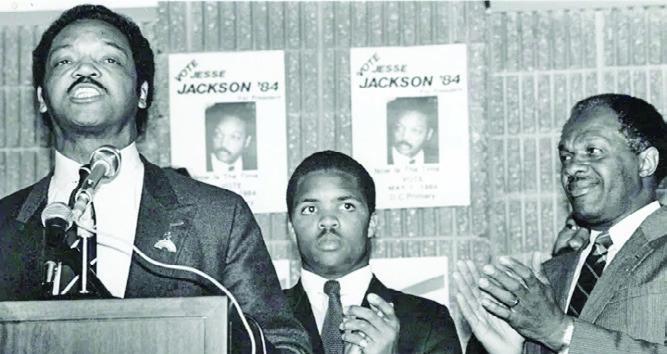 From left: The Rev. Jesse Jackson Sr. speaks during an event for his 1984 presidential campaign as Jesse Jackson Jr. and D.C. Mayor Marion Barry look on. (WI photo)