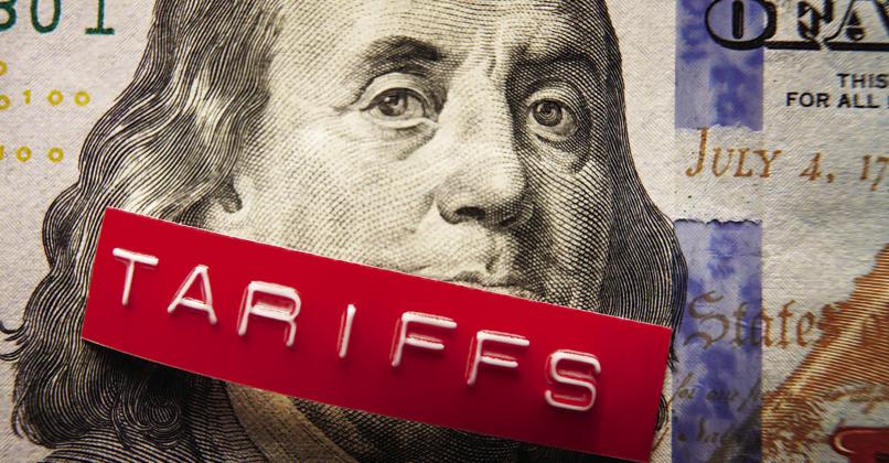 Tariffs label on a hundred dollar bill (photo via NNPA)