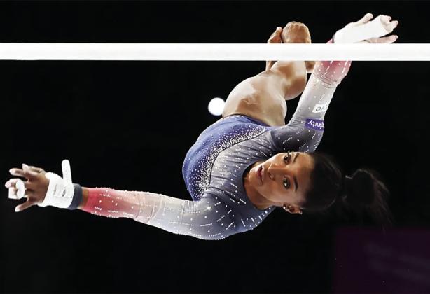 US gymnast Simone Biles competes on the uneven bars during the women’s team final at the Artistic Gymnastics World Championships in Antwerp, Belgium, on October 4, 2023 [Geert vanden Wijngaert/AP Photo]