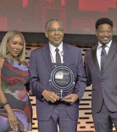 Lewis Diuguid (center) being inducted into the National Association of Black Journalists Hall of Fame. (Texas Metro News)