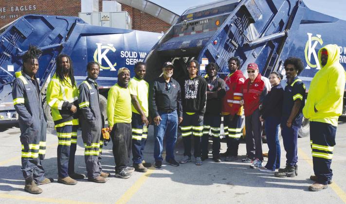 FIFTH DISTRICT SPRING CLEAN UP—KCMO Public Works Department employees (in reflective gear) pose with 5th District City Councilman Darrell Curls (center in jeans) and South Kansas City Alliance President John Sharp and SKCA Board Member Karissa Varga (3rd &amp;amp; 2nd from right) at the drop-off site for unwanted household items at Ruskin High School during the annual 5th Council District spring cleanup on May 17 that the Alliance assists with.