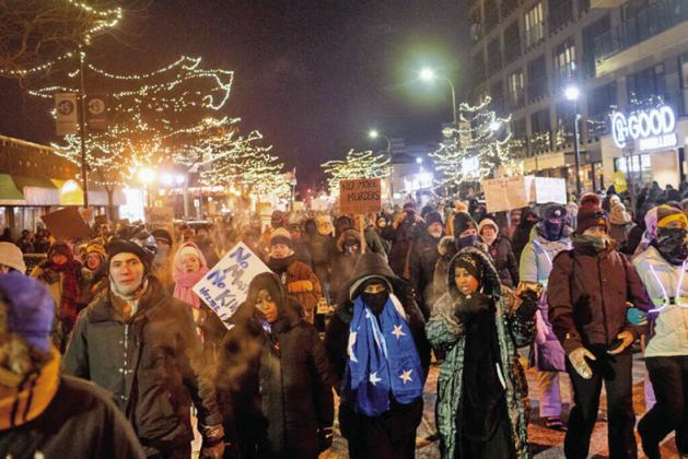 Hundreds gather around a growing memorial site at 26th Street and Nicollet Avenue South in Minneapolis, where federal agents shot and killed Alex Pretti Saturday, Jan. 24, 2026 earlier in the day. (Photo by Nicole Neri/Minnesota Reformer)