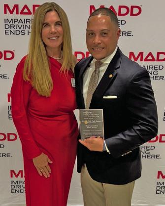 (Left) MADD victim services specialist Heather Elder presents Missouri State Representative Mark Sharp with the Roll Call Award.