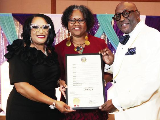 Mo. Sen. Barbara Washington (center) presents a Proclamation to GH&amp;amp;H founder Jessica McClellan (left) and husband, Kevin (right)