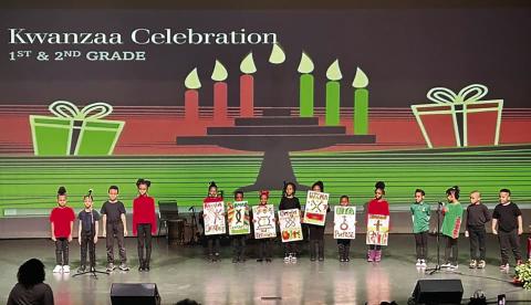 First and second grade students from African Centered College Preparatory Academy at the Kwanzaa celebration.