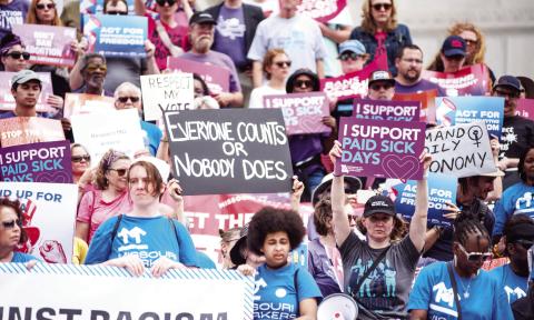 Protestors hold up signs criticizing Missouri lawmakers’ recent votes to overturn ballot measures passed in 2024 during a rally on the Missouri Capitol steps Thursday (Annelise Hanshaw/Missouri Independent).