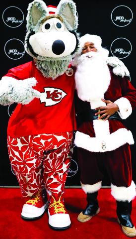 (Above) KC Chiefs Justin Reid (dressed as Santa) with Chiefs’ mascot, KC Wolf.