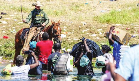As shown in this photo above, these and other images of Haitians seeking asylum at the U.S. southern border are being met with outrage by many across the aisle in Congress. Majority leader Sen. Chuck Schumer said, “Images of Haitian migrants being hit with whips and other forms of physical violence is completely unacceptable.” Courtesy photo/Getty Images