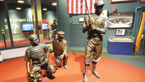 Bronze figures of historic Negro Leagues players greet visitors to the Negro Leagues Baseball Museum in Kansas City, Mo. photo/Carlos Moreno