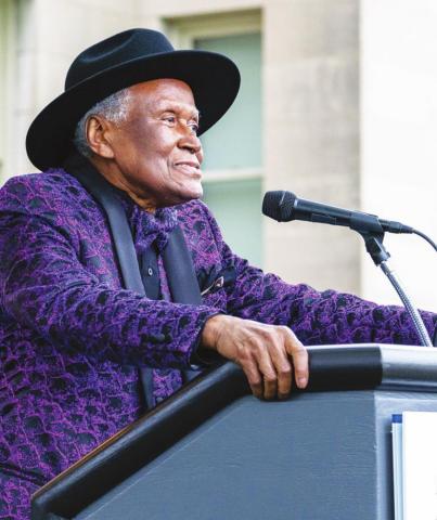 Alvin Brooks speaks to the crowd who attended a celebration on Tuesday that was planned in his honor. The event was held at the Kansas City Museum.
