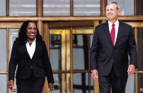 Justice Ketanji Brown Jackson and Chief Justice John Roberts walk out of the Supreme Court after her investiture ceremony last Friday. photo/Saul Loeb / AFP - Getty Images