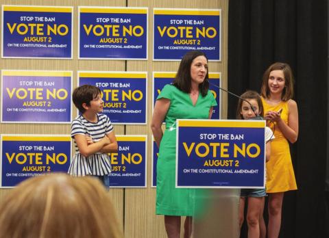 Ashley All, spokeswoman for Kansans for Constitutional Freedom, gives a speech Aug. 2, 2022, at a watch party in Overland Park after primary results verified Kansans voted to preserve abortion rights. (Courtesy Lily O’Shea Becker/Kansas Reflector)