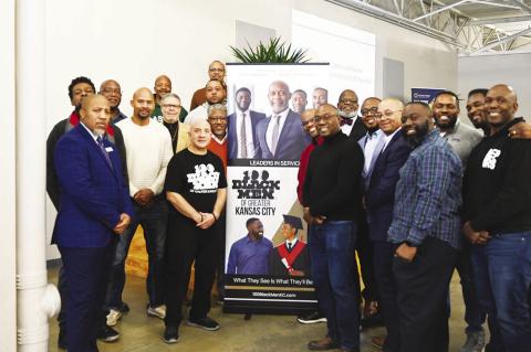 Shown above are some of the 100 Black Men members at the Dollars &amp; Sense Program that trains high school students