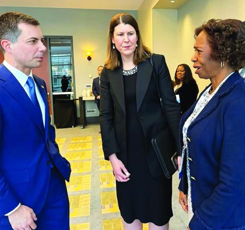 U.S. Transportation Secretary Pete Buttigieg ( left) at the Transportation Research Board (TRB) convention in Washington, D.C., recently chats with TRB officials Executive Director Victoria Sheehan, and Chairman Dr. Carol Abel Lewis (right).