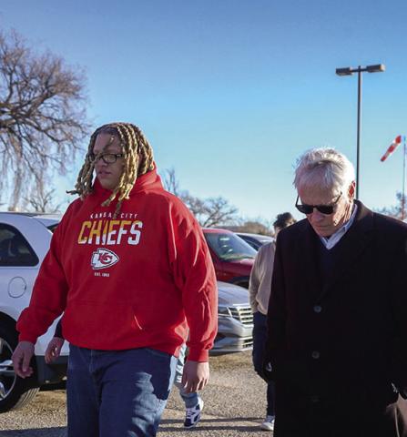 Deshaun Durham, left, and his attorney Barry Grissom, right, on Dec. 6, 2024, leave a Hutchinson prison after Durham’s sentence for a marijuana offense was shortened. (photo/Last Prisoner Project)