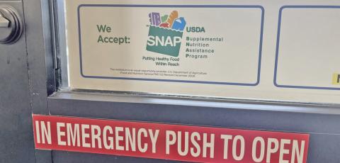 A sign advertises that SNAP benefits are accepted at a grocery store in Fargo, North Dakota, on July 7, 2026. (Photo by Ceilidh Kern for the North Dakota Monitor)