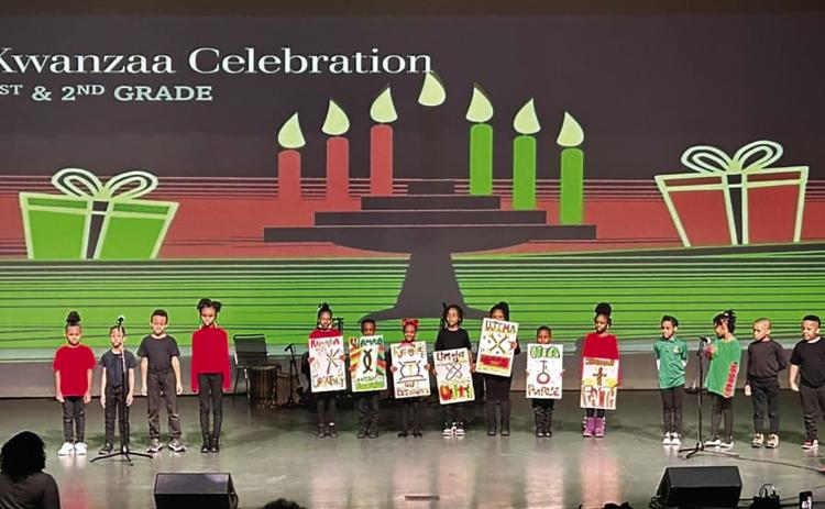 First and second grade students from African Centered College Preparatory Academy at the Kwanzaa celebration.