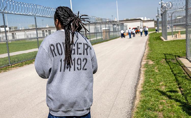 Men exercise in the maximum security yard of the Lansing Correctional Facility in Lansing, Kan. The prison population in Kansas rose nearly 5% between 2022 and 2023 (John Moore/Getty Images)