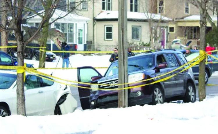 The purple SUV driven by Renee Macklin sits damaged at the intersection of 34th Street and Portland Avenue in south Minneapolis after she was shot by an ICE agent on Wednesday. Macklin later died from her injuries. State officials and witnesses said federal agents prevented a doctor at the scene from providing lifesaving CPR. (Courtesy Minnesota Spokesman-Recorder)