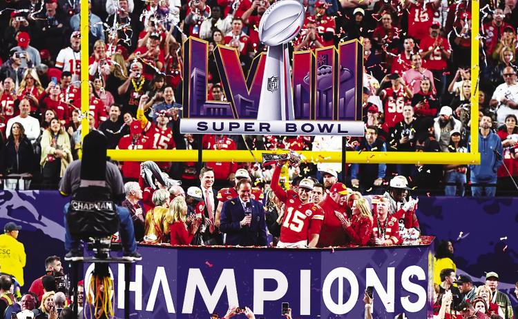 Kansas City Chiefs Quarterback Patrick Mahomes hoists the trophy after Sunday’s Super Bowl LVIII victory over the 49ers. courtesy photo/kcchiefs