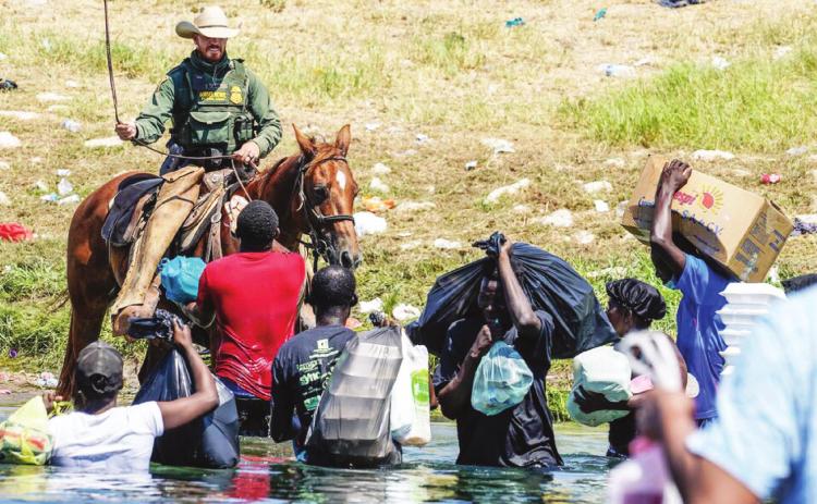 As shown in this photo above, these and other images of Haitians seeking asylum at the U.S. southern border are being met with outrage by many across the aisle in Congress. Majority leader Sen. Chuck Schumer said, “Images of Haitian migrants being hit with whips and other forms of physical violence is completely unacceptable.” Courtesy photo/Getty Images