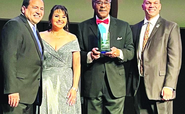 Hispanic Chamber of Commerce President/CEO Carlos Gomez presented the Community Impact Award to Congressman Cleaver (third from left) for his advocacy in Congress, including securing a $4 million earmark to expand the Chamber’s outreach in Kansas City.