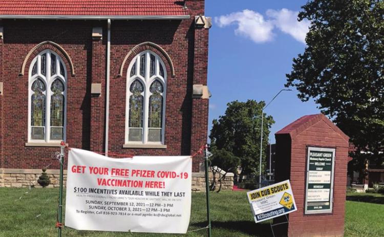 A banner outside welcomed attendees to UMKC’s “Our Healthy Kansas City Eastside” vaccination event Sunday at Pleasant Green Missionary Baptist Church.