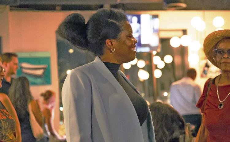 Stacy Lake celebrates victory in the Jackson County Executive Democratic primary at Cliff’s Taphouse in Kansas City on August 4, 2026. (Cassandra Isobelle Flores /KCUR 89.3)