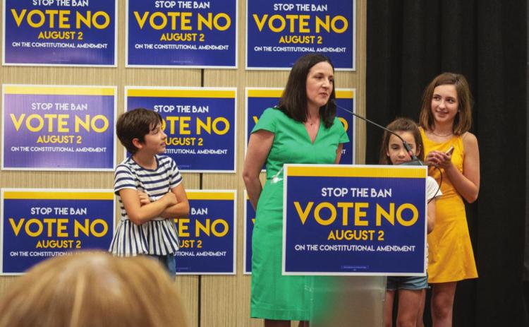 Ashley All, spokeswoman for Kansans for Constitutional Freedom, gives a speech Aug. 2, 2022, at a watch party in Overland Park after primary results verified Kansans voted to preserve abortion rights. (Courtesy Lily O’Shea Becker/Kansas Reflector)