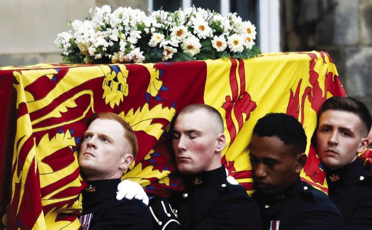 Queen Elizabeth II, who passed away last Thursday, September 8, is being remembered by throngs of mourners at various services that have been held all week long. Her funeral will be held September 19 at Westminster Abbey. In this photo, the Queen’s coffin arrives at the Palace of Holyroodhouse in Edinburgh on Sunday, September 11. Alkis Konstantinidis/Pool/AP