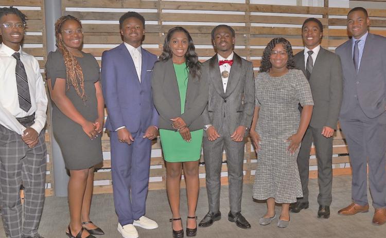 Beta Omega Chapter of the Omega Psi Phi Fraternity Inc. recently presented $1,000 awards to eight 'Distinguished Scholars.' Shown at the reception from left to right: Quentin King, Makayla McConnell, Kaleb Smith, Chloe Ervin, Christian Graham, Skylah Canady, Langston Humphrey, Davis Long.