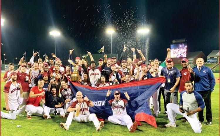 The Kansas City Monarchs baseball team and some of its management staff pose for a photo after securing the championship with a 7-6 win over the Chicago Dogs at Legends Field Wednesday night. photo/Morgan Kolenda