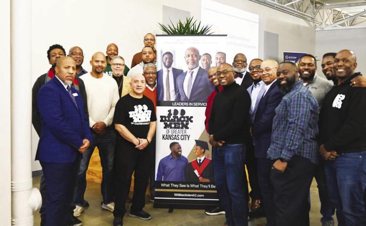 Shown above are some of the 100 Black Men members at the Dollars &amp; Sense Program that trains high school students