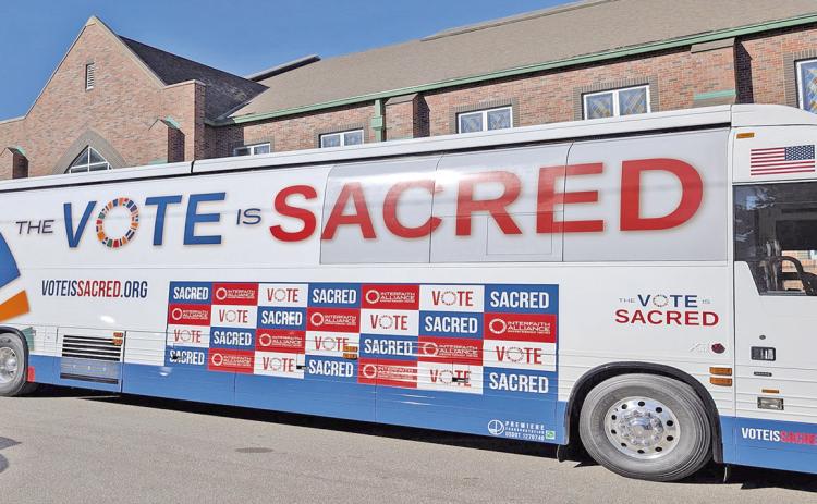 The bus for Interfaith Alliance “The Vote Is Sacred Tour” parked outside St. James United Methodist Church in Kansas City, Missouri, on Oct. 5, 2026. (Brian Kaylor/ Word&amp;Way)